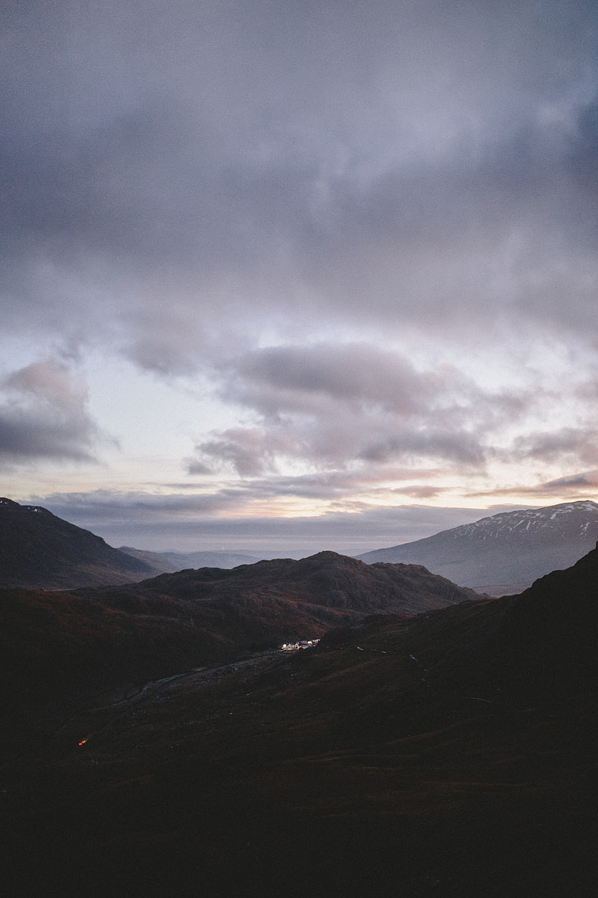 Dramatic moody mountain landscape at dusk with clouds
