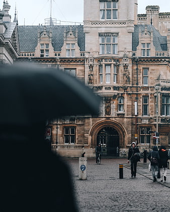 Historic stone architecture with blurred foreground umbrella