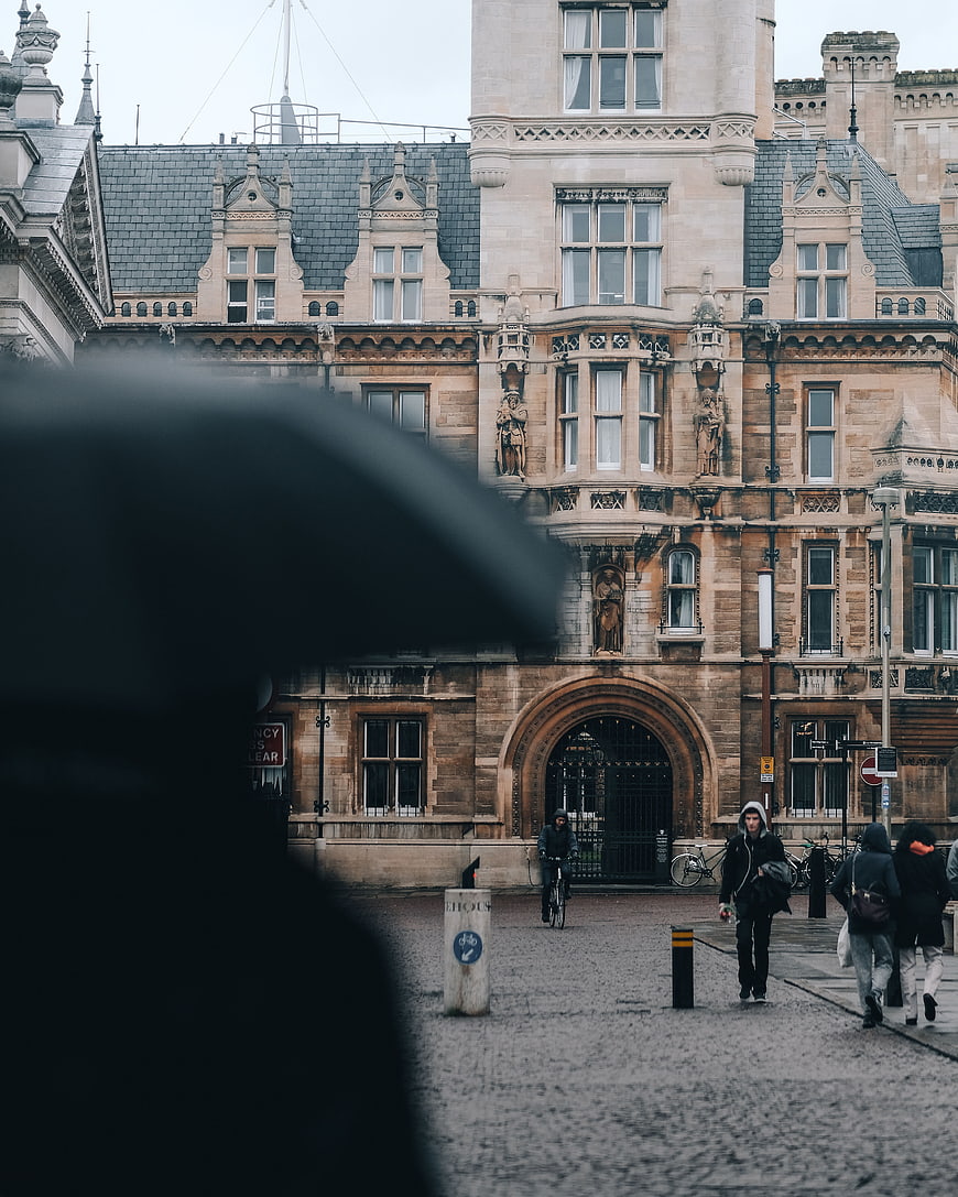 Historic stone architecture with blurred foreground umbrella