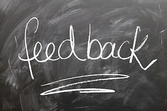 Handwritten Feedback Word on Chalkboard