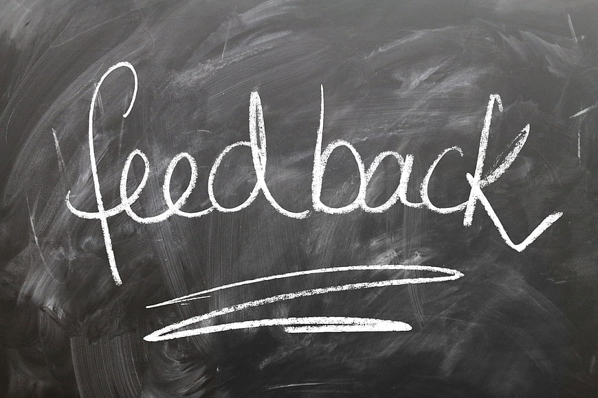 Handwritten Feedback Word on Chalkboard