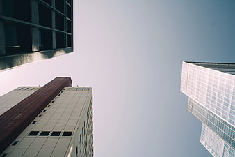 Low Angle View of Modern Skyscrapers Against Blue Sky
