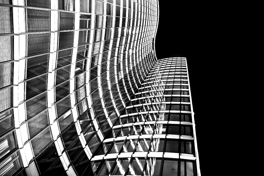 Black and White Curved Glass Skyscraper Architecture