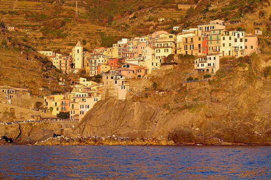 Colorful coastal village on steep cliffs overlooking the sea