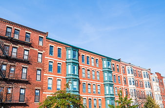 Colorful Urban Row Houses with Teal Bay Windows