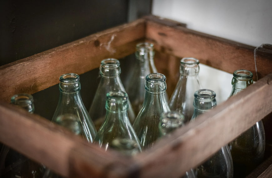 Vintage Green Glass Bottles in Wooden Crate