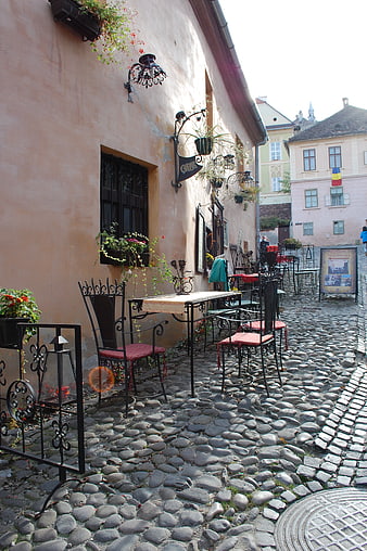Cobblestone Street Cafe in Historic Romanian Town