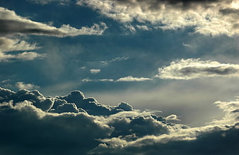 Dramatic Gray Nimbus Clouds with Sunbeams Breaking Through
