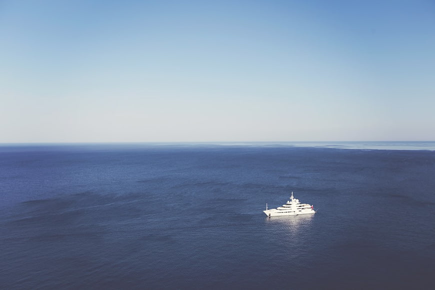 Aerial View of White Luxury Yacht on Blue Ocean