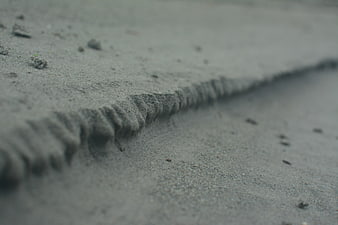 Close-up of textured sand ripples on a beach