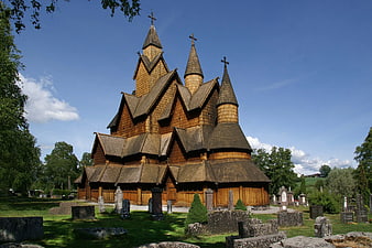 Historic Wooden Stave Church in Norwegian Landscape