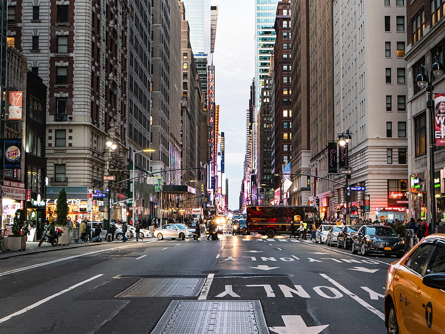 Wide Manhattan Street View with Yellow Taxi and City Traffic