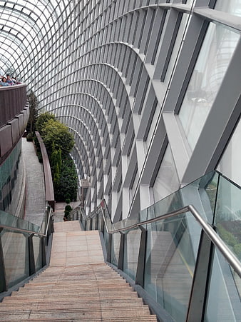 Modern architectural staircase inside glass dome conservatory