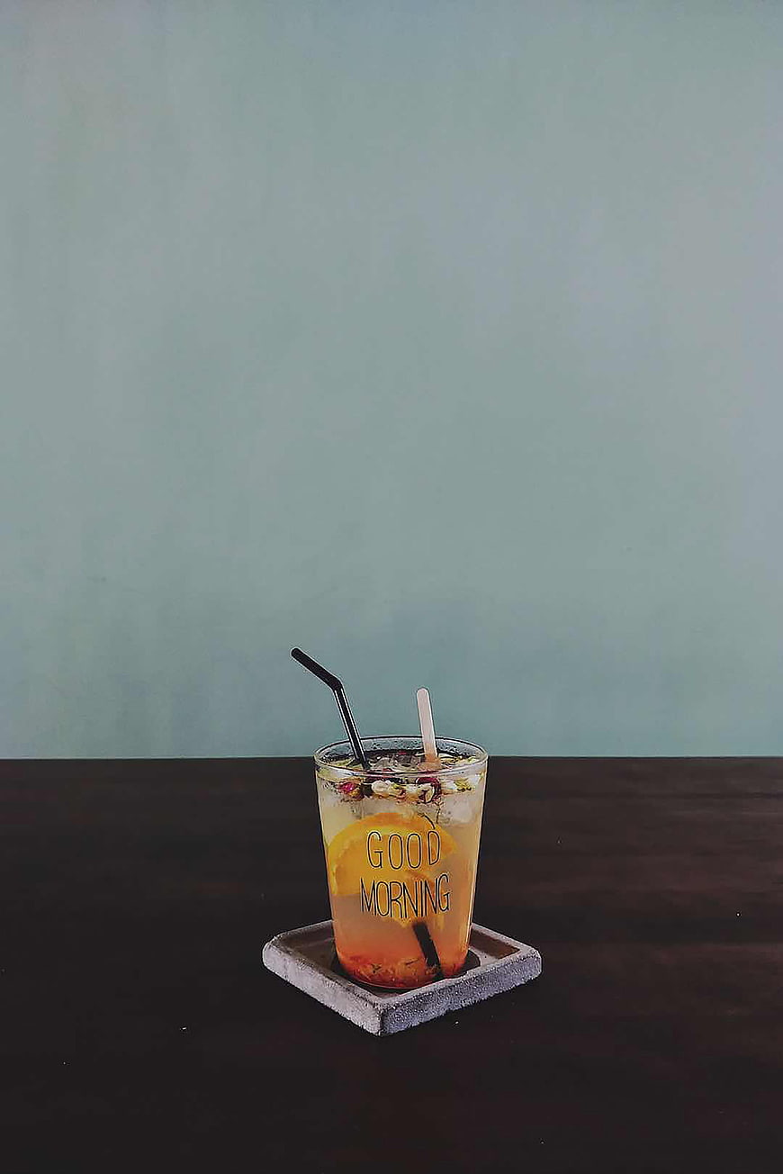 Iced fruit drink with good morning text on glass