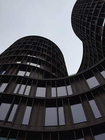 Low angle view of modern curved skyscraper architecture
