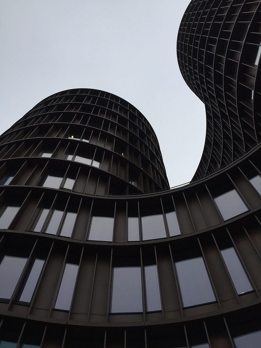 Low angle view of modern curved skyscraper architecture