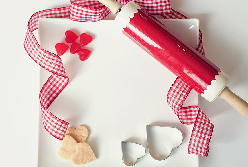 Valentine's Day Baking Setup with Rolling Pin and Heart Cookies