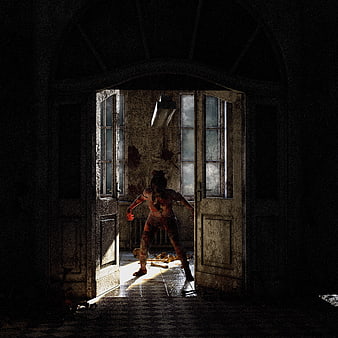 Bloody female zombie standing in doorway of dark abandoned building