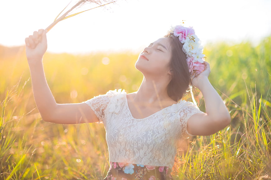 Woman with Flower Crown in Golden Grass Field