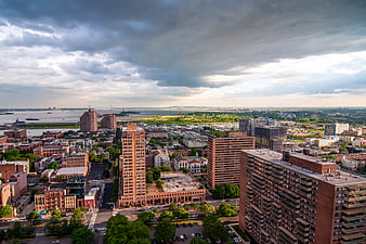 Aerial View of Urban Cityscape with Dramatic Clouds