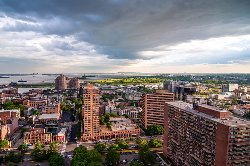 Aerial View of Urban Cityscape with Dramatic Clouds