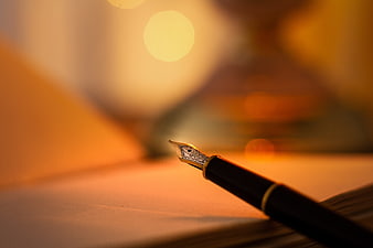 Fountain Pen Nib Close-Up With Warm Bokeh Background