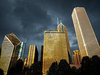 Dramatic Chicago Skyline with Golden Skyscrapers and Stormy Sky