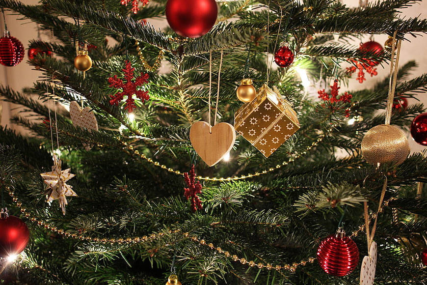 Close-up of Christmas tree with red and gold ornaments