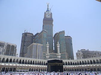 Kaaba in Mecca with Makkah Clock Tower and pilgrims