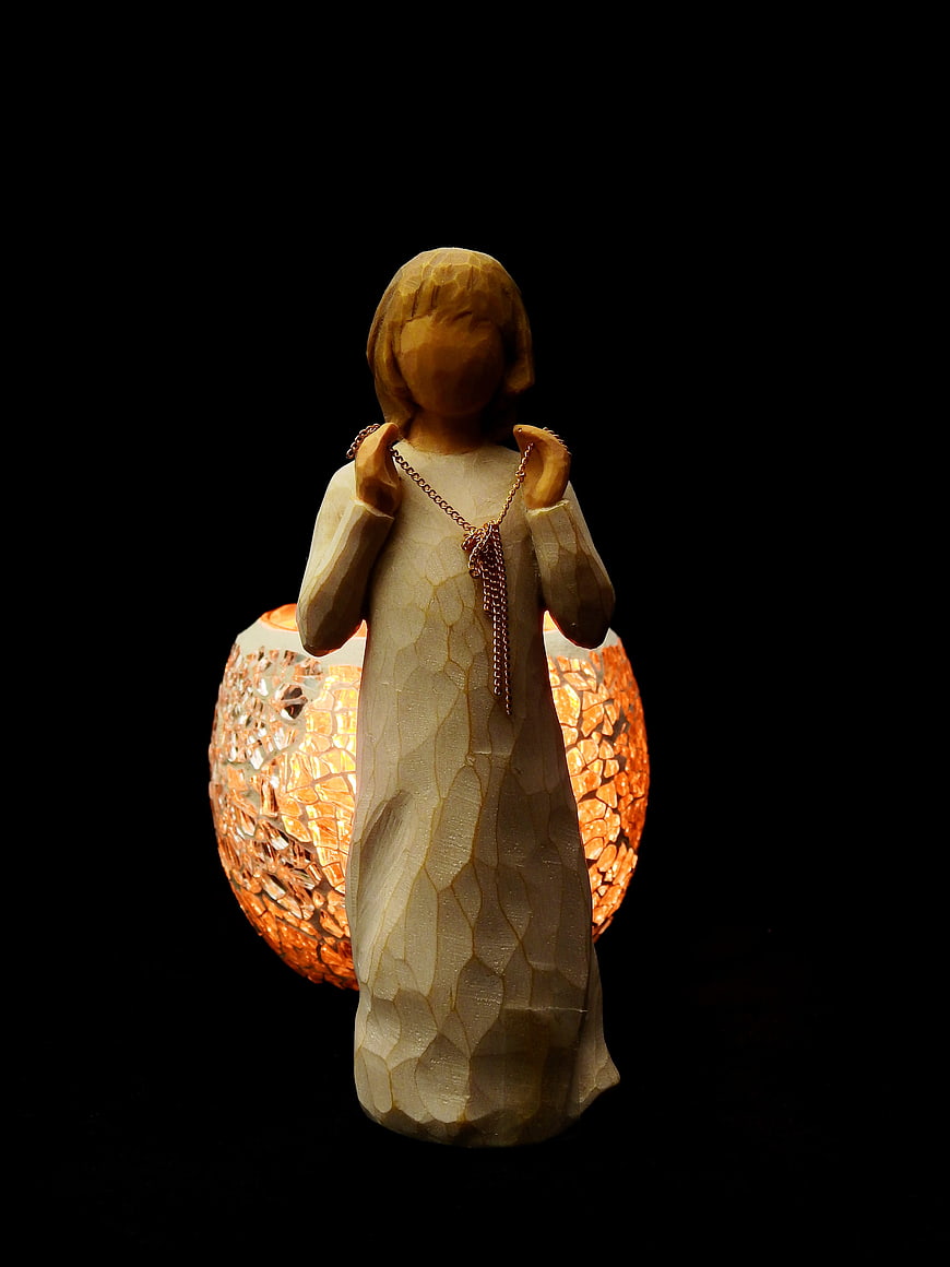 Wooden angel figurine with mosaic candle holder