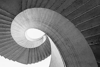 Black and white spiral staircase architecture looking up