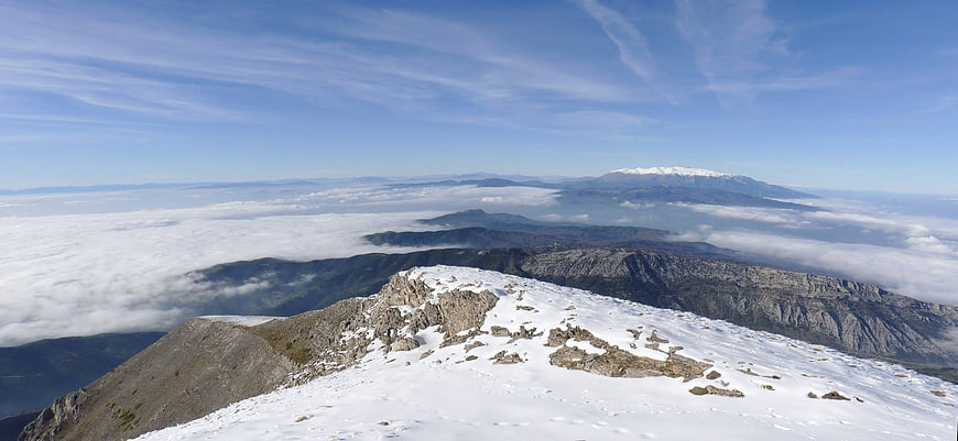 Panoramic Snowy Mountain Peak Above Sea of Clouds