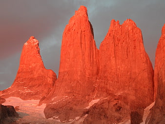 Torres del Paine granite peaks glowing red at sunset