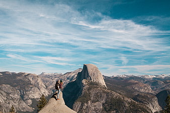 Hikers on Half Dome Viewpoint in Yosemite National Park