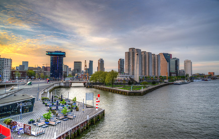 Amsterdam IJ waterfront skyline at sunset with modern architecture