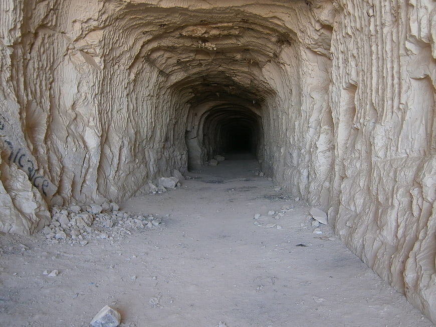 Rough Hewn Stone Tunnel Interior with Arched Ceiling