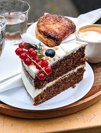 Slice of Carrot Cake with Red Currants and Coffee