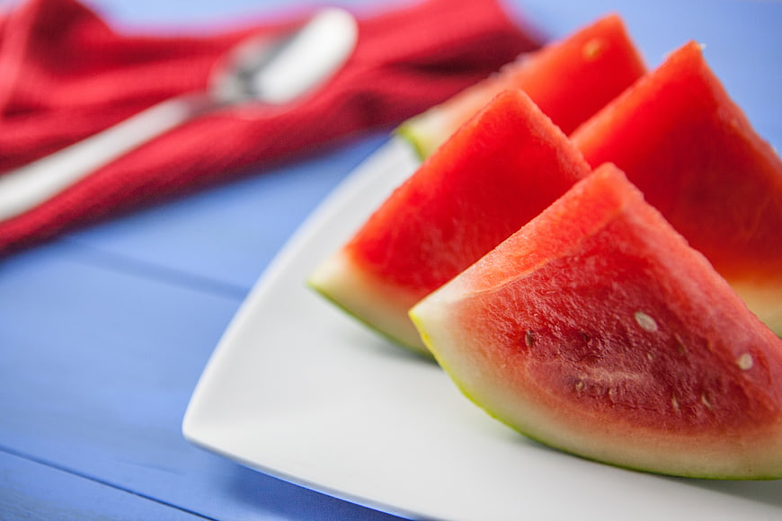 Fresh Watermelon Slices on White Plate with Red Napkin