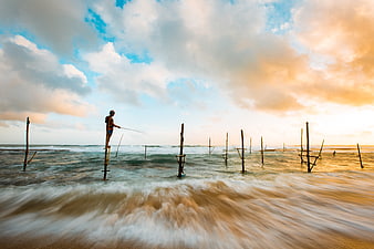 Stilt Fisherman at Sunset in the Ocean