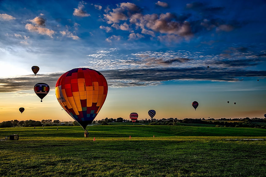 Colorful Hot Air Balloons Launching at Sunset