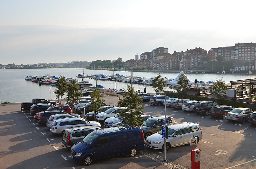 Harbor parking lot with boats and city skyline