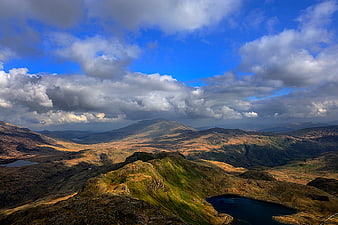 Dramatic Mountain Landscape with Clouds and Lakes