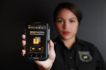 Police Officer Holding Body Camera Smartphone