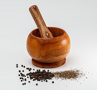 Wooden Mortar and Pestle with Black Peppercorns