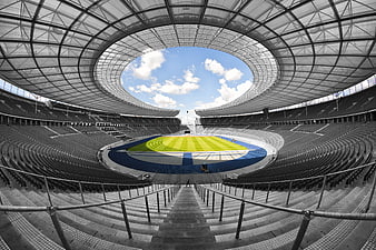 Symmetrical View of Empty Olympic Stadium with Blue Sky