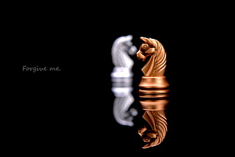 Gold and White Chess Knights Facing Each Other on Black Background