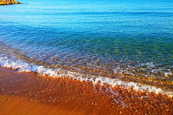 Crystal Clear Turquoise Sea Waves on Sandy Beach
