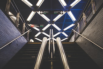 Symmetrical NYC Subway Staircase With Fluorescent Ceiling Lights