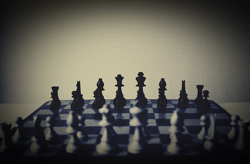 Dramatic Chess Pieces on Board with Bokeh Background