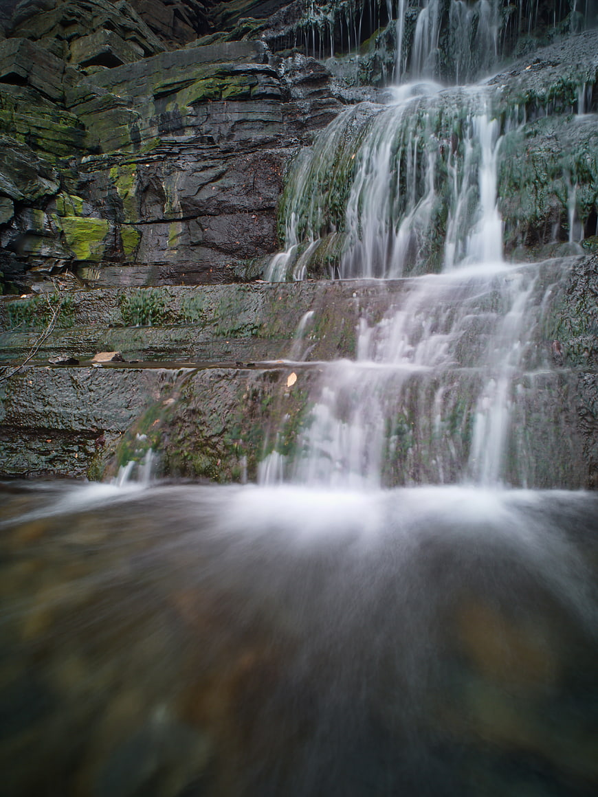 Mossy Rock Waterfall with Long Exposure Flowing Water